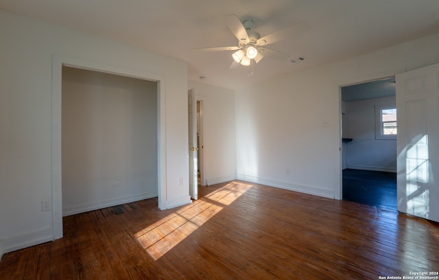 interior space with ceiling fan and wood-type flooring