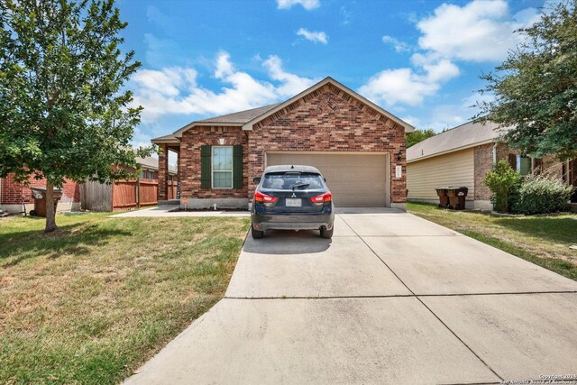 view of front facade with a garage and a front yard