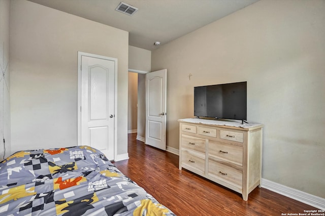 bedroom featuring dark hardwood / wood-style flooring