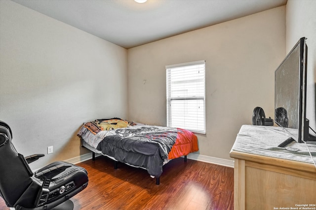 bedroom featuring dark hardwood / wood-style flooring