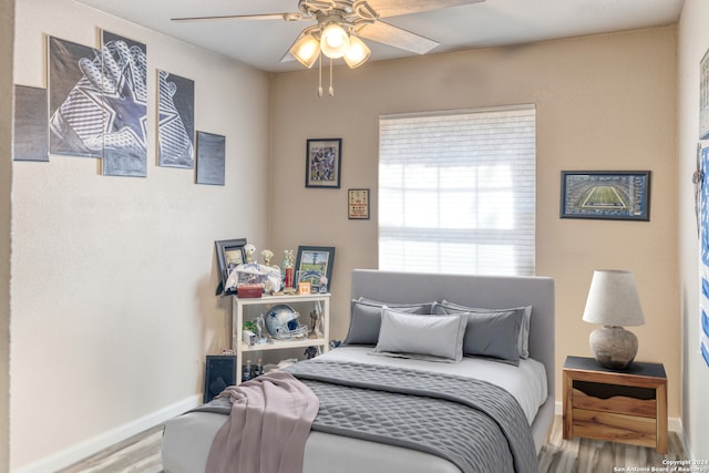 bedroom featuring ceiling fan and wood-type flooring