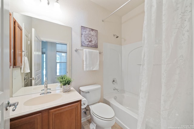 full bathroom with tile patterned flooring, toilet, shower / bathtub combination with curtain, and vanity