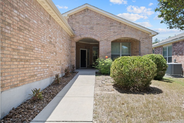 doorway to property featuring central AC unit