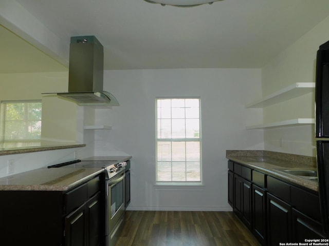 kitchen with island range hood, dark cabinets, dark wood-type flooring, stainless steel range with electric stovetop, and open shelves