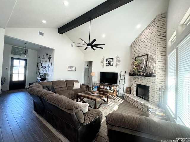 living room featuring high vaulted ceiling, a large fireplace, ceiling fan, dark hardwood / wood-style floors, and beam ceiling