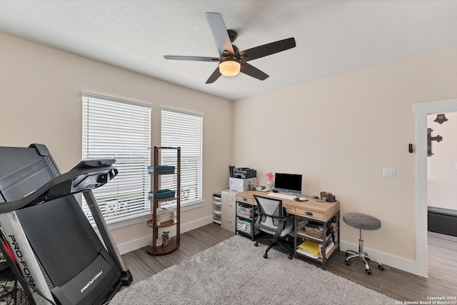 office area featuring ceiling fan, wood-type flooring, and a textured ceiling