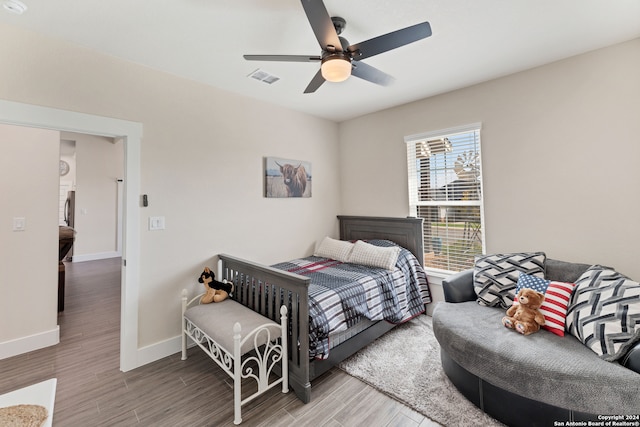 bedroom with wood-type flooring and ceiling fan