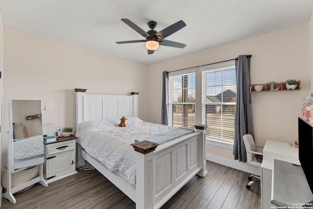 bedroom with dark hardwood / wood-style flooring and ceiling fan