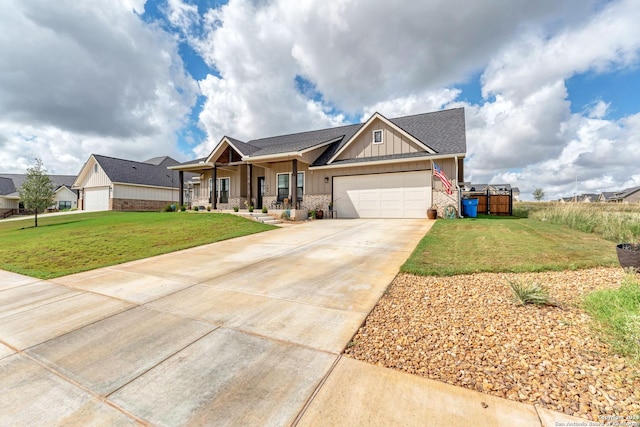 craftsman-style house featuring a garage, a front yard, and a porch