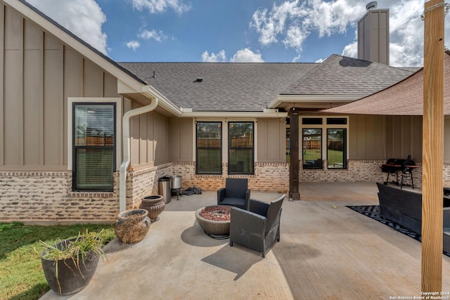 view of patio with grilling area and an outdoor fire pit