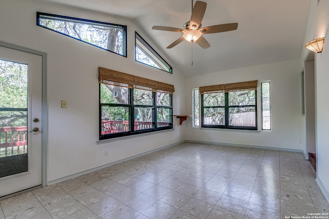 unfurnished room featuring ceiling fan, high vaulted ceiling, and light tile patterned floors