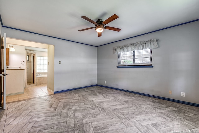 unfurnished room with ceiling fan, crown molding, a healthy amount of sunlight, and light parquet floors