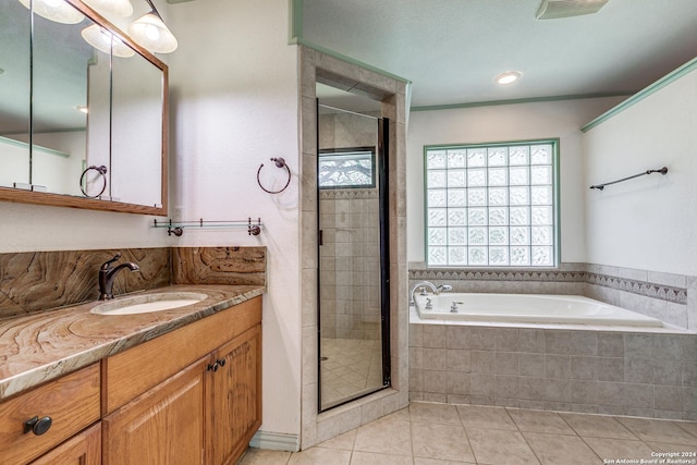 bathroom with a garden tub, visible vents, a shower stall, vanity, and tile patterned flooring