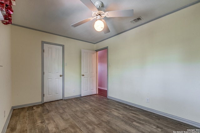 unfurnished bedroom featuring ceiling fan and hardwood / wood-style flooring