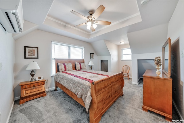 bedroom featuring ceiling fan, a wall mounted air conditioner, light carpet, and a tray ceiling