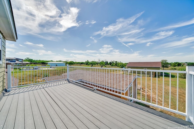 wooden deck with a yard