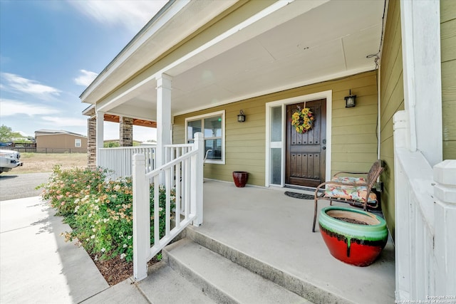 doorway to property with covered porch