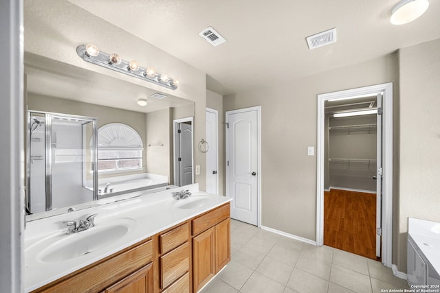 full bathroom with a bath, a sink, and visible vents