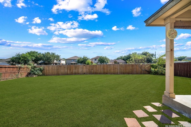 view of yard with a fenced backyard