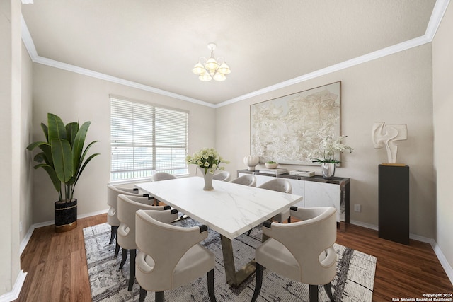 dining area with baseboards, ornamental molding, dark wood-style flooring, and an inviting chandelier