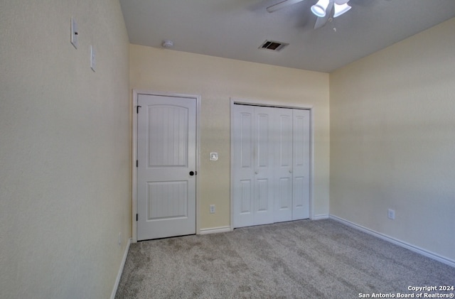 unfurnished bedroom with light colored carpet and ceiling fan