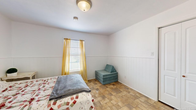 tiled bedroom featuring a closet