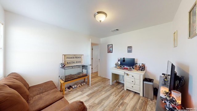 living room with light hardwood / wood-style flooring