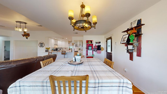 dining room featuring an inviting chandelier and wood-type flooring