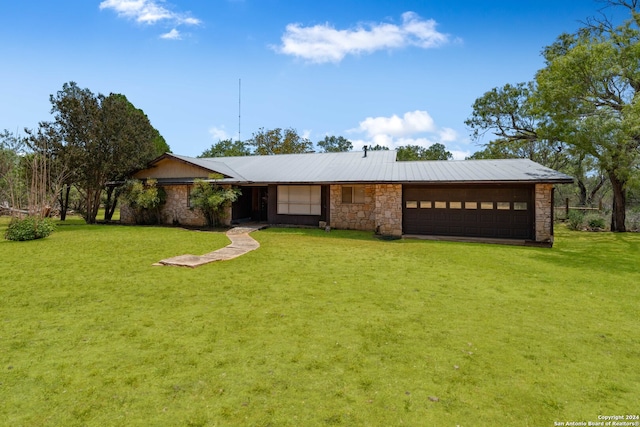 single story home with a garage and a front yard