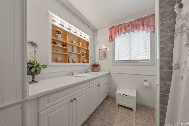 bathroom featuring tile patterned floors and vanity