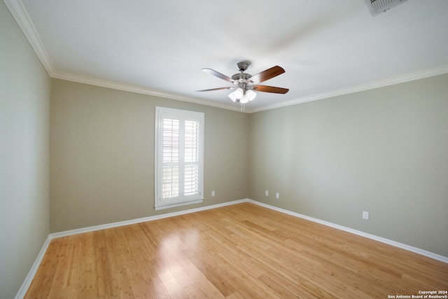 unfurnished room with ceiling fan, crown molding, and light wood-type flooring