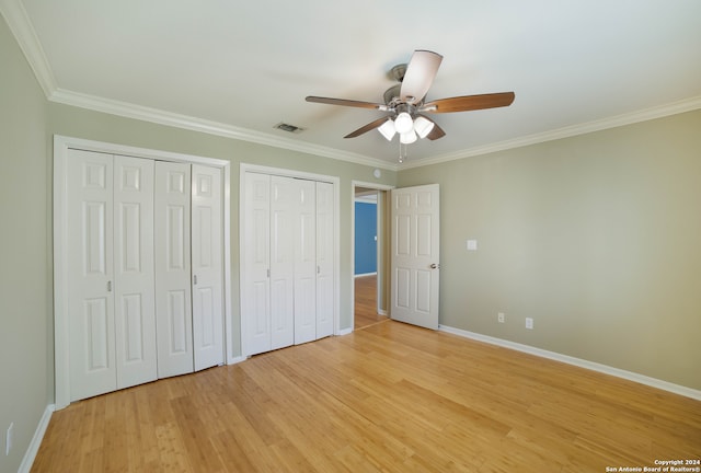 unfurnished bedroom featuring ceiling fan, light hardwood / wood-style flooring, and ornamental molding