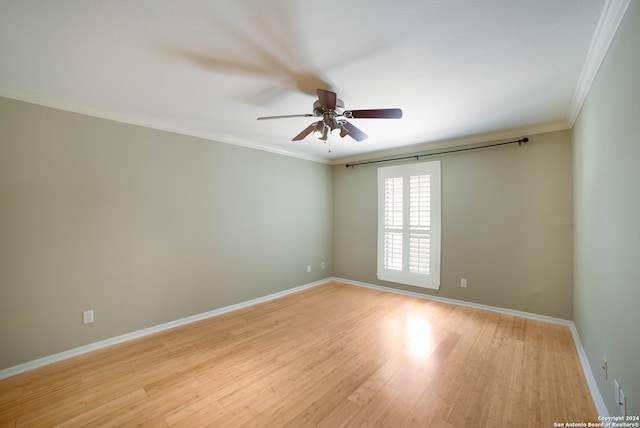 unfurnished room with ceiling fan, crown molding, and light wood-type flooring