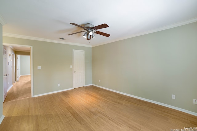 spare room with ceiling fan, light hardwood / wood-style floors, and ornamental molding