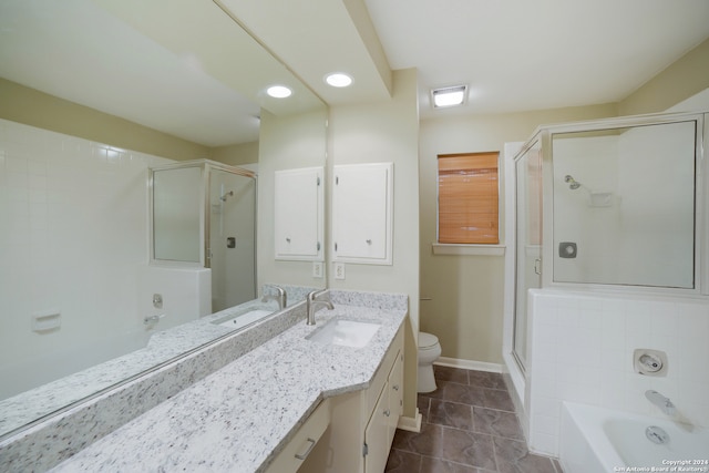 full bathroom featuring toilet, independent shower and bath, vanity, and tile patterned floors