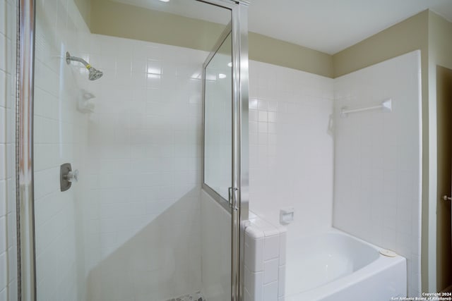 bathroom with shower with separate bathtub