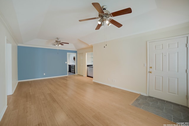 unfurnished living room with ceiling fan, hardwood / wood-style floors, crown molding, and lofted ceiling