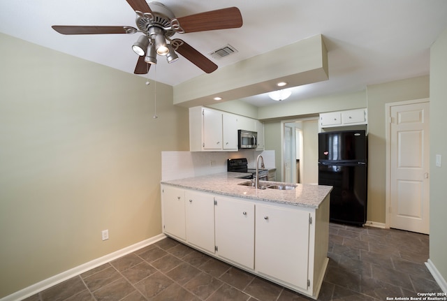 kitchen featuring ceiling fan, stainless steel appliances, kitchen peninsula, and dark tile patterned floors