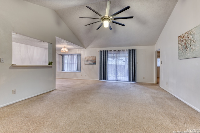 unfurnished living room with high vaulted ceiling, ceiling fan, light carpet, and a textured ceiling