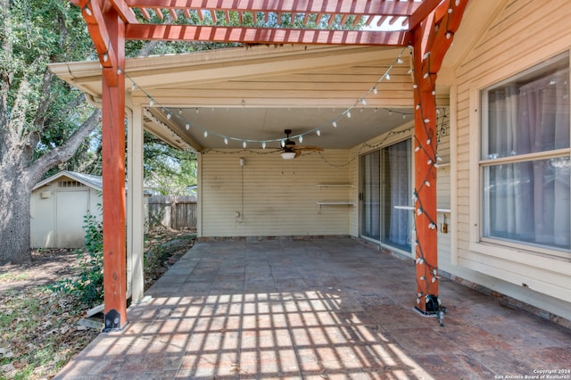 view of patio with a pergola and a storage unit