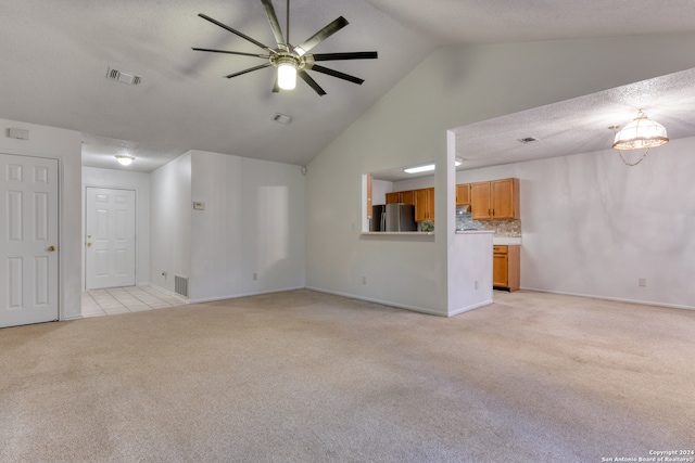 unfurnished living room with high vaulted ceiling, ceiling fan, and light tile patterned floors