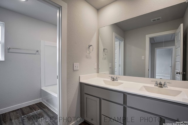 bathroom with vanity and hardwood / wood-style floors