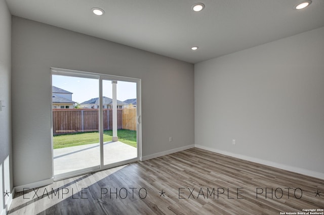 spare room with light wood-type flooring