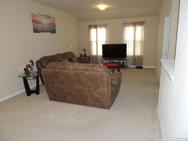 living room featuring vaulted ceiling and light carpet