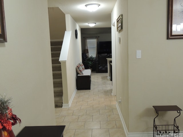 hall with light tile patterned flooring