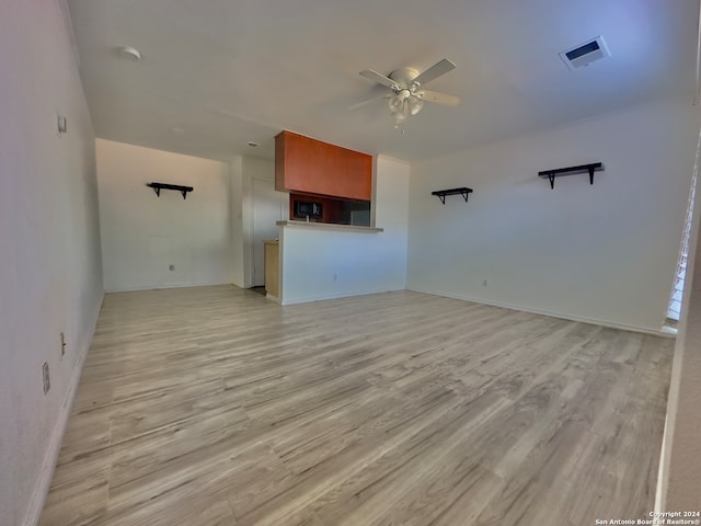 unfurnished living room with ceiling fan and light hardwood / wood-style flooring