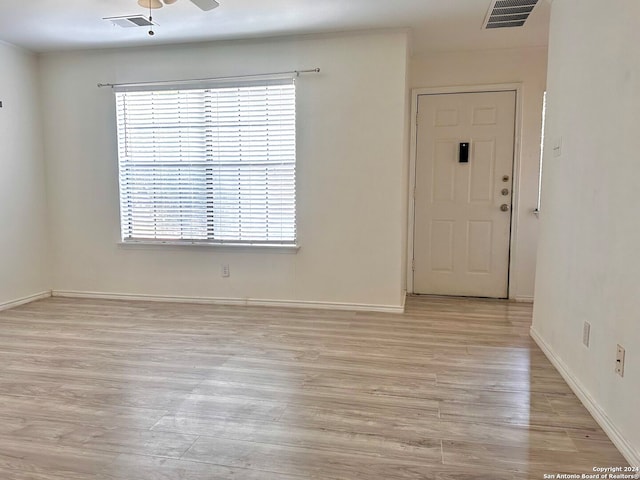 entryway featuring light wood-type flooring, plenty of natural light, and ceiling fan