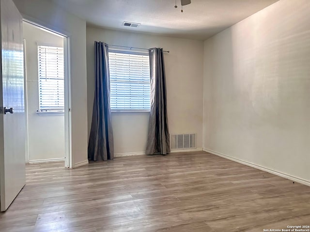 unfurnished room featuring light wood-type flooring