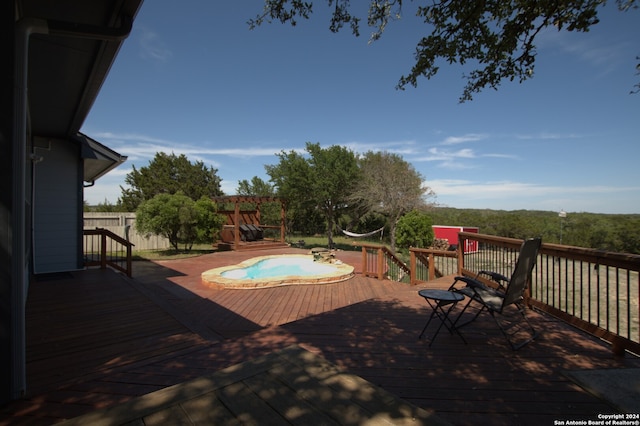 view of swimming pool with a wooden deck