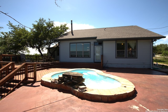 view of swimming pool featuring a deck